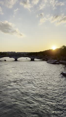 Eiffel Tower and Seine River at sunset in Paris, France