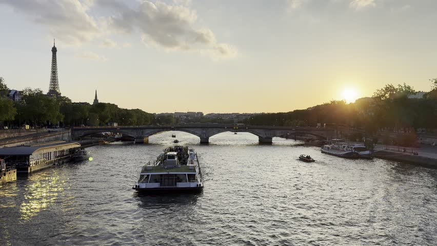 Eiffel Tower and Seine River at sunset in Paris, France