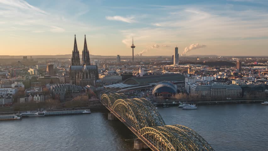Cologne (Koln) Germany time lapse day to night high angle view city skyline at Cologne Cathedral (Cologne Dom) with Rhine River and Hohenzollern Bridge