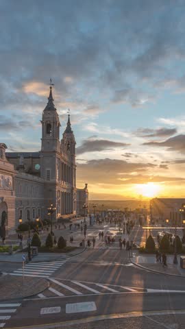 Madrid Spain time lapse day to night sunset city skyline at Cathedral de la Almudena (vertical)