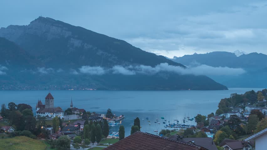 Spiez Switzerland time lapse night to day city skyline at Lake Thun