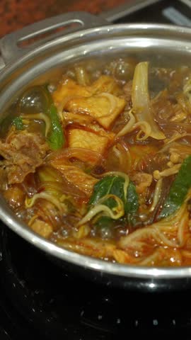 Boiling fish cake soup with noodles and vegetables