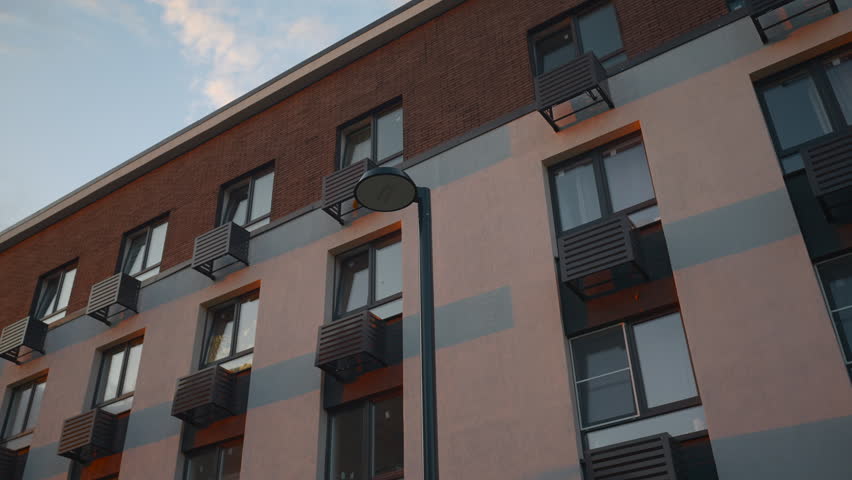 Residential apartment building facade viewed from below