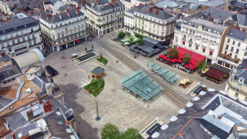 Aerial view of Place du Ralliement with tram tracks, cafes, and historic buildings