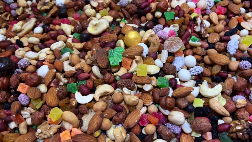 Delicious assorted trail mix with nuts, dried fruits, and colorful candies