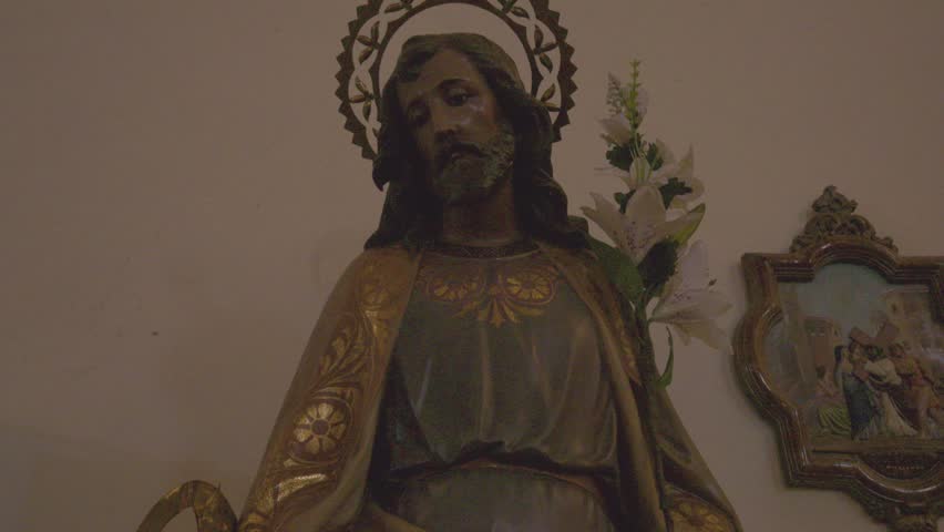 Statue of Saint Joseph holding the child Jesus Christ inside a catholic church