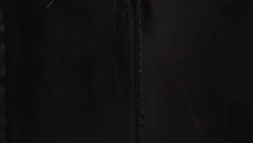 Close Up of Heavy Industrial Metal Welding Action Performing on Massive Structural Frame Part. Manufacturing Assembly Line Operations Inside European Engineering Workshop Facility Slow Motion 4k