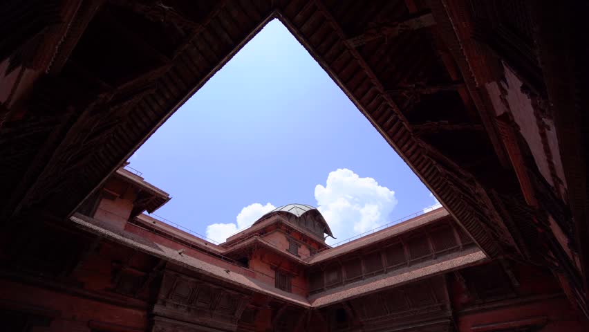 Ancient brick courtyards and carved wooden architecture inside Hanuman Dhoka Durbar Square in Kathmandu, Nepal