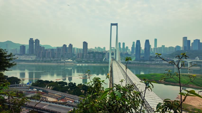 Jiefangbei Skyline Behind The Dongshuimen Yangtze River Bridge In Chongqing, China. - pan right shot