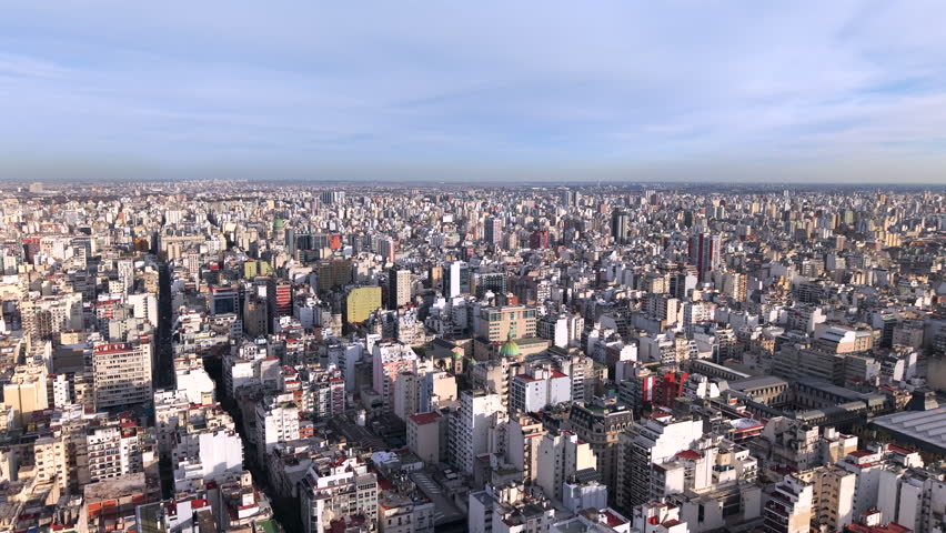 Aerial Til Down Dense Populate Cityscape in Buenos Aires Argentina, Drone view Rooftops and Street Traffic, Skyline to Central Neighborhood