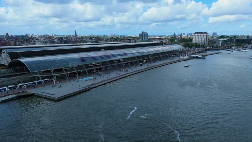 The drone is flying in The Netherlands Amsterdam near central station 