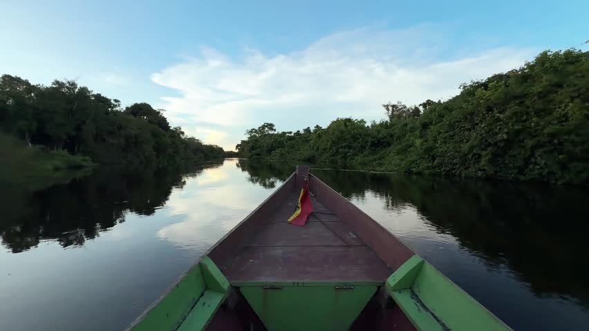 POV Sailing on a Traditional Wooden Boat in the Bolivian Amazon Jungle at Sunset