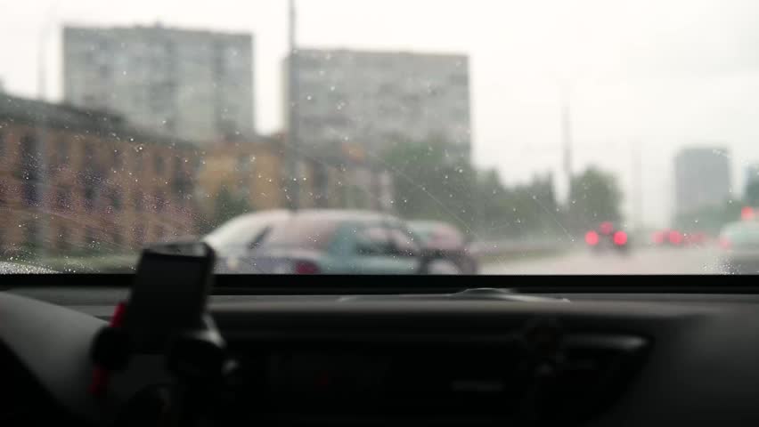 Driving through city traffic on a rainy day