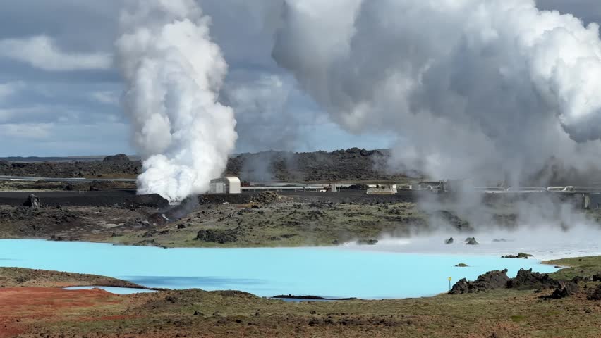 Steam billowing from the Svartsengi geothermal power plant amidst a rugged volcanic terrain. A sustainable energy solution producing both electricity and heat