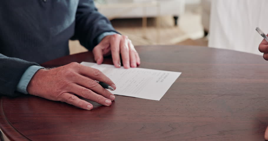 Hands, agent and old man with paperwork signature for asset transfer, beneficiary form or compliance. Finance advisor, senior client or sign document in home for authority agreement, approval or help