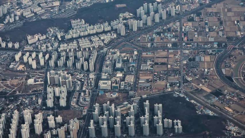 Flying Above Seoul, South Korea. Airplane Passenger Point of View