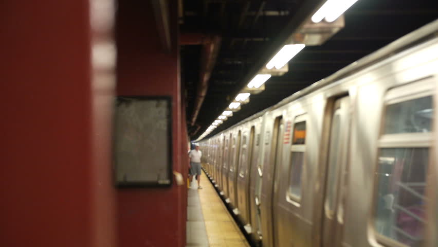 A New York City subway leaves the platform.