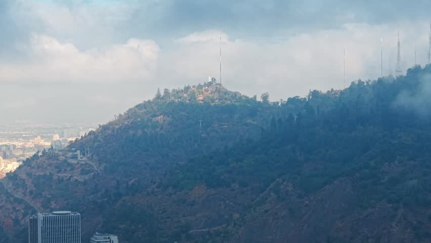 Aerial rising to summit of San Cristobal Hill, Santiago, Chile