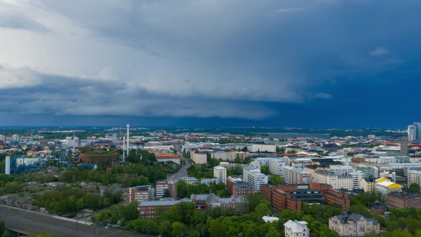 Hyperlapse drone shot of lightning and thunder clouds rolling over Helsinki