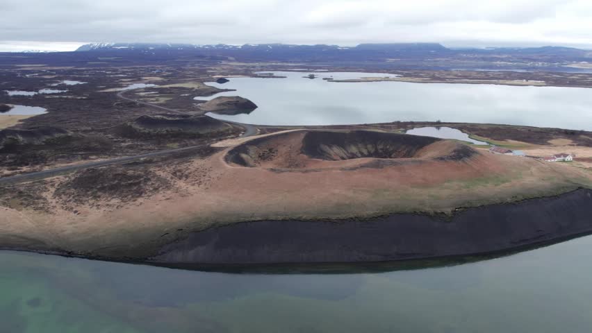 Stunning aerial footage flying over the unique Skutustadagigar pseudocraters surrounding the beautiful Lake Myvatn in northern Iceland