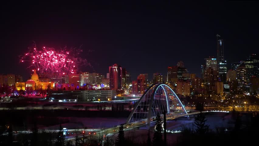 Spectacular Fireworks Over Edmonton Skyline and Walterdale Bridge at Night