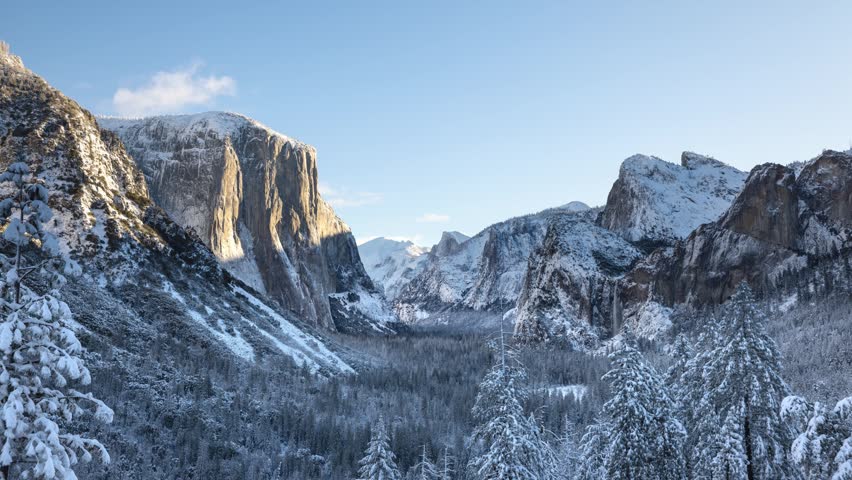 Time lapse of a snowy winter landscape looking down Yosemite Valley in Yosemite National Park