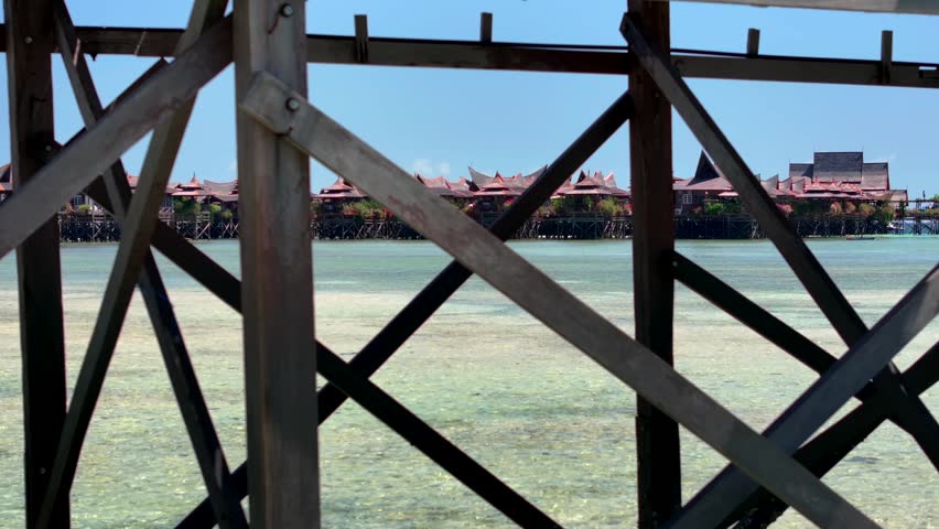 Luxury Resort on a Beautiful Mabul Island. Stilt Houses above a Blue sea, Coral Reef, Aerial. Semporna, Sabah, Malaysia.