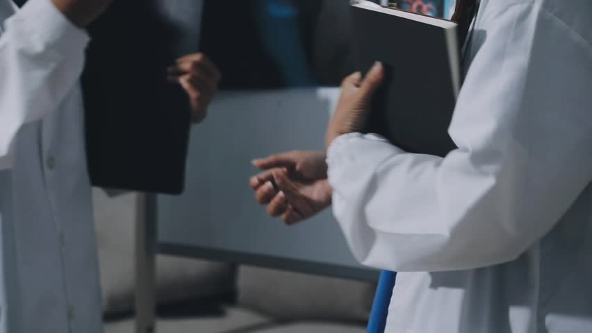 Thoughtful doctors having meeting in hospital
