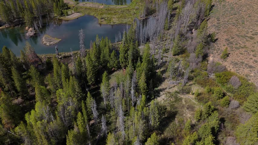 Top down orbit of Boulder Mountains in the Sawtooth National Recreation Area, Idaho on a sunny day in spring.