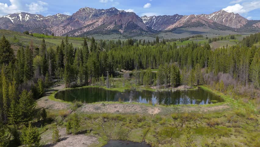 Aerial truck shot of Boulder Mountains in the Sawtooth National Recreation Area, Idaho on a sunny day in spring.