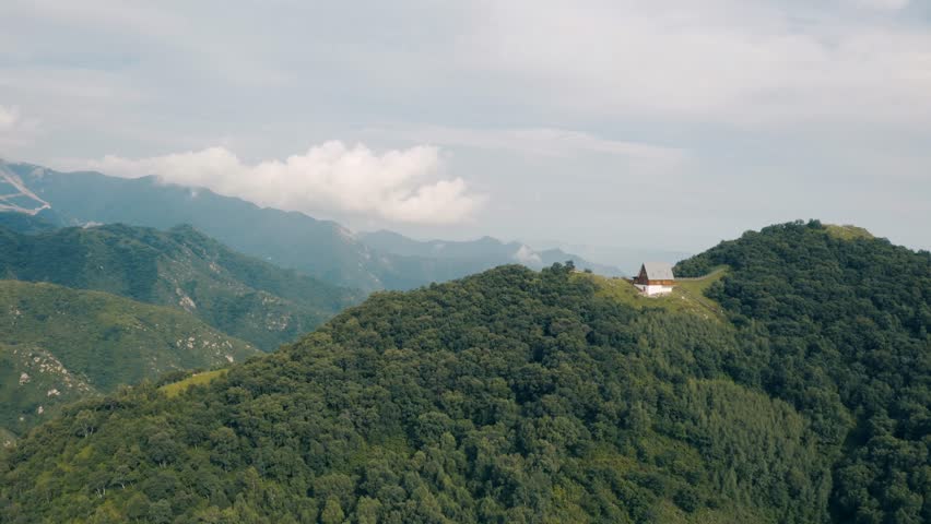 Aerial Approach To European Style Cabin On Haituo Mountain