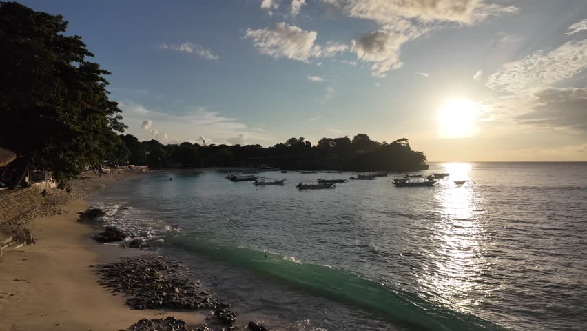 Colorful sunset over Mushroom Bay beach on nusa lembongan