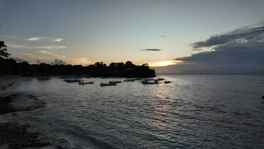 Colorful sunset over Mushroom Bay beach on nusa lembongan