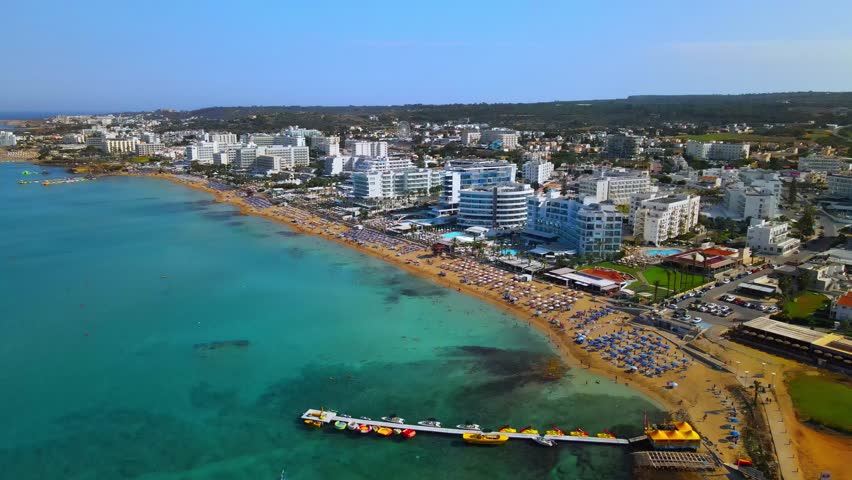 Aerial Drone View of Protaras Cyprus, Luxury Beachfront Hotels, Golden Sandy Beach and Crystal Clear Mediterranean Sea
