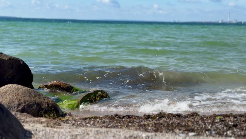 Sandy coastline with sea waves