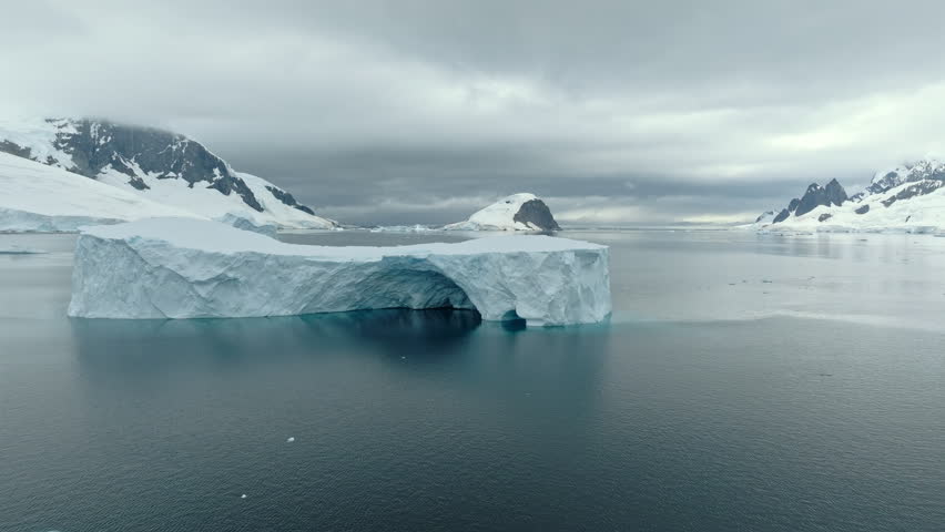 Drone View of Tabular Iceberg with Arch in Antarctica