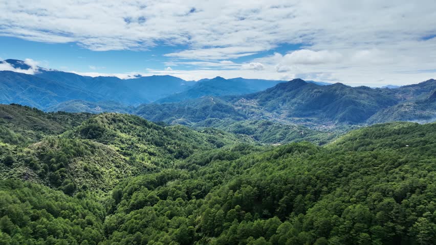 Aerial shot of the low mountains and forest near the small town of Sagada in the Philippines.