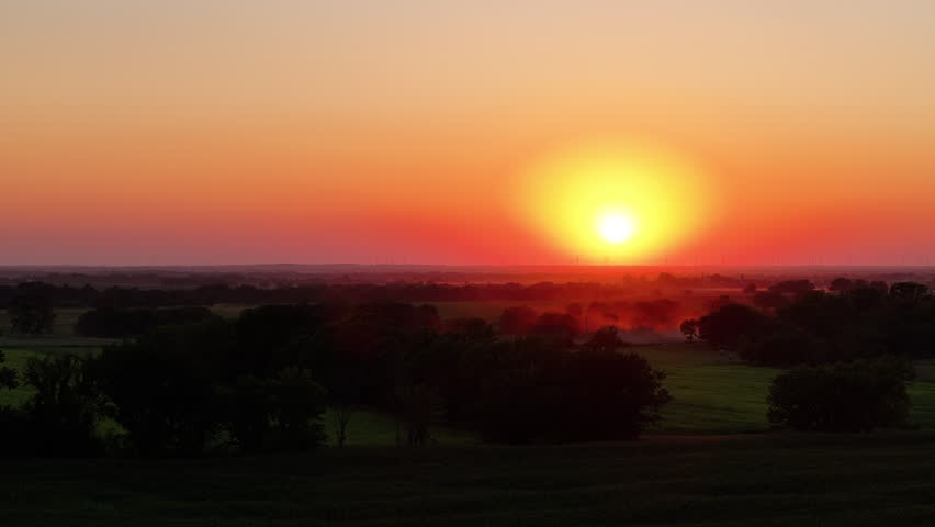 Sunset in Kansas fly over farm fields golden hour