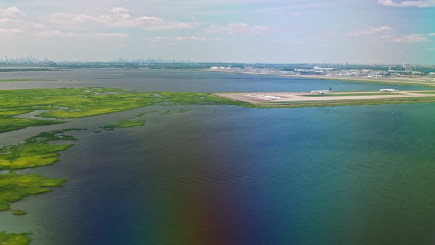 Beautiful view from airplane window during landing approach to JFK Airport over Jamaica Bay. New York. USA.