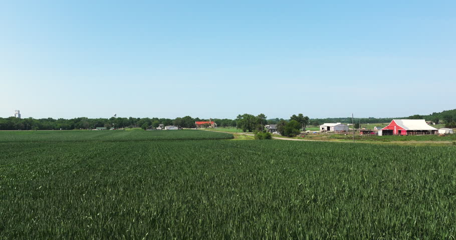 Rising over fields farmland midwest Kansas