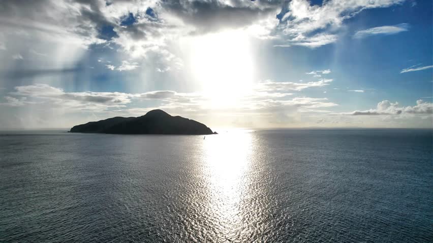 Island silhouette and golden sunset over calm ocean in Okinawa
Drone aerial footage captured near Kaminohama Coast in Okinawa, Japan. Crystal clear turquoise waters, tropical islands, dramatic cloud formations, and beautiful coastal scenery viewed from above.