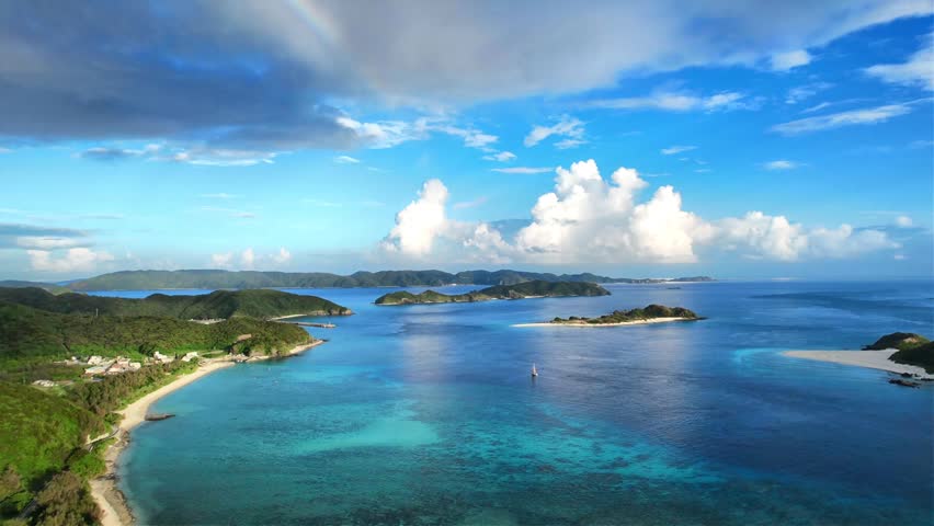 Aerial panorama of Okinawa coastline with coral reef waters
Drone aerial footage captured near Kaminohama Coast in Okinawa, Japan. Crystal clear turquoise waters, tropical islands, dramatic cloud formations, and beautiful coastal scenery viewed from above.