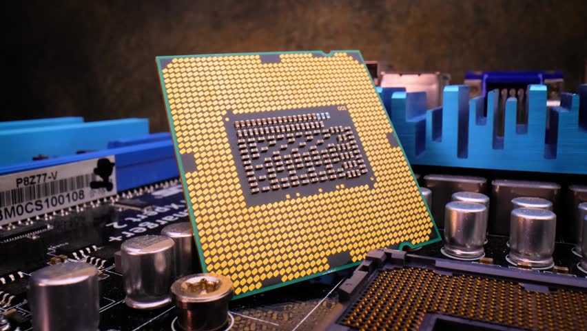 Processor on motherboard, golden pins, circuit board, technology, motion.