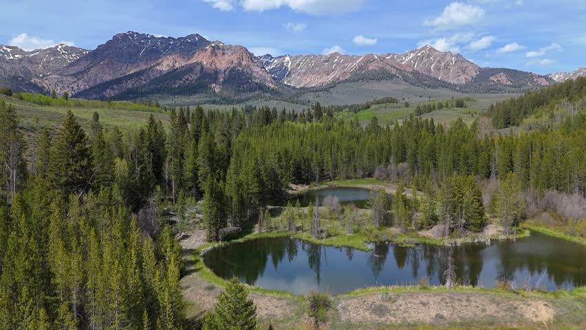 Aerial truck shot of Boulder Mountains in the Sawtooth National Recreation Area, Idaho on a sunny day in spring.