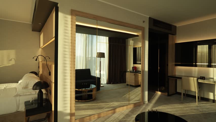 Boutique hotel room interior with large mirror and desk