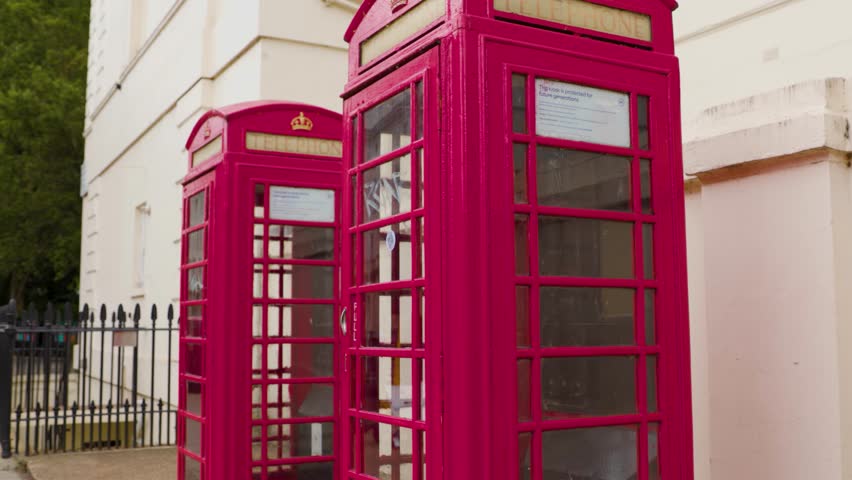 Red Telephone Booths Lined Up Outside London Building