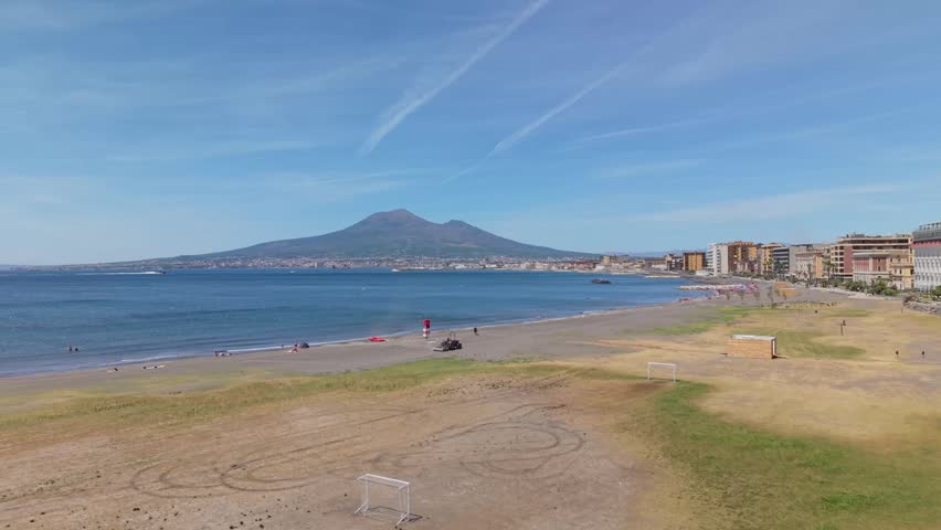Aerial view of Mount Vesuvius and sandy beach along the Gulf of Naples in Castellammare di Stabia, Italy