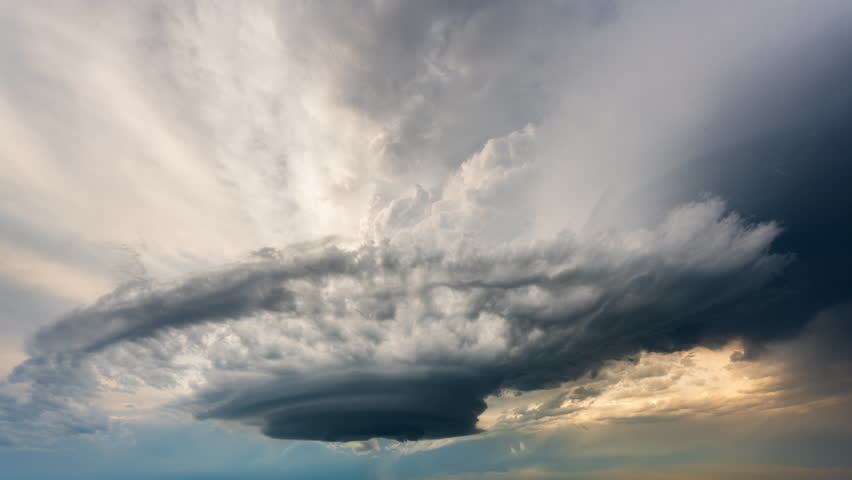 Dark storm clouds swirl and shift across the sky with turbulent motion and dramatic atmospheric textures, creating an intense weather scene filled with tension, instability and powerful natural energy