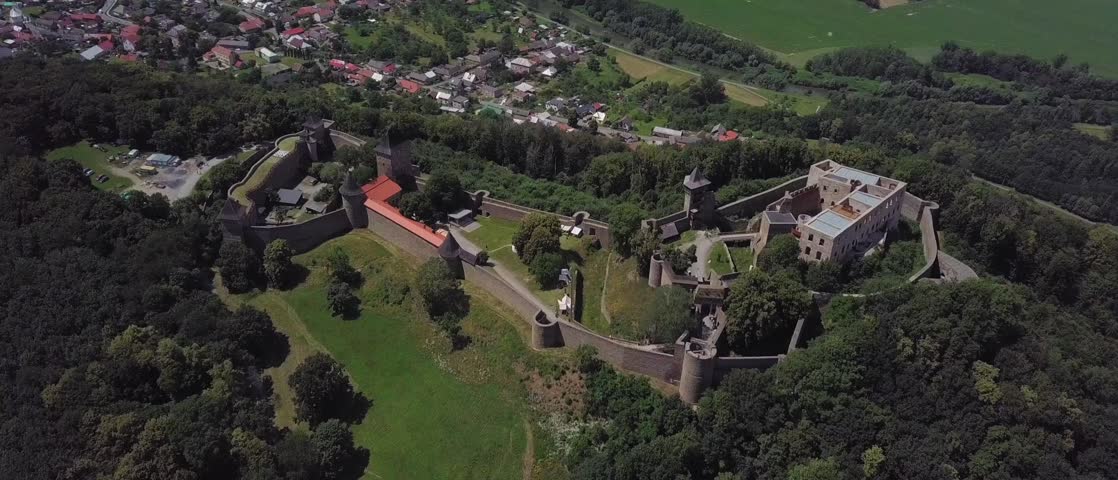 Aerial shot looking down upon ancient medieval stone castle