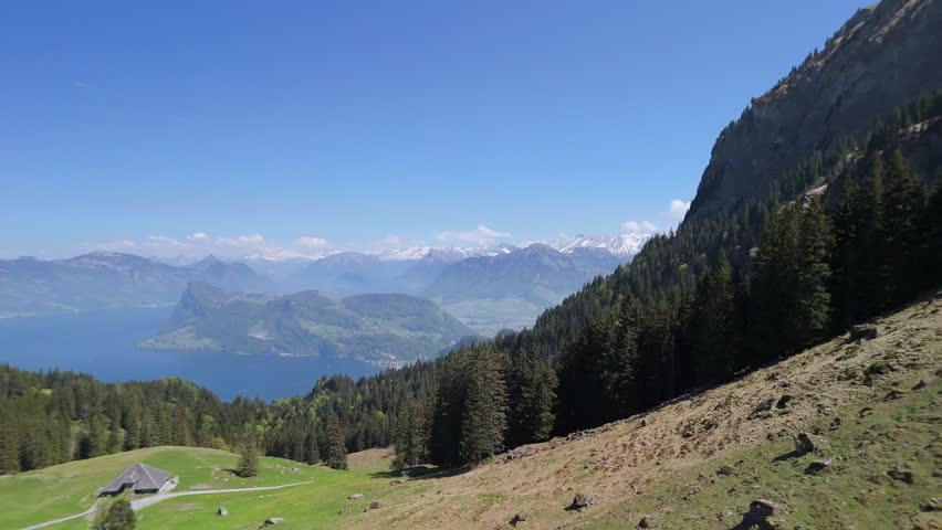 Cinematic aerial drone footage of Mount Pilatus near Lucerne, Switzerland, showcasing dramatic alpine peaks, mountain ridges, and scenic Swiss Alps landscape. Ideal for travel, tourism, nature, advent